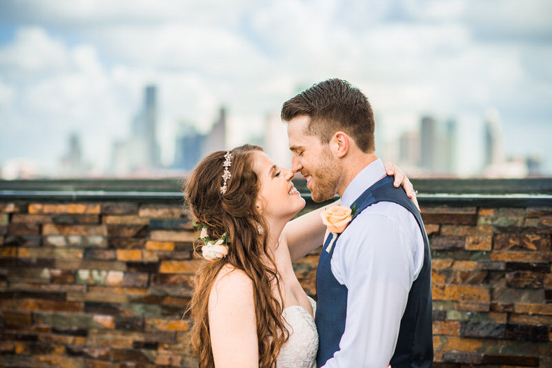 Bride and Groom at 1111 Studewood with the Houston skyline in the background