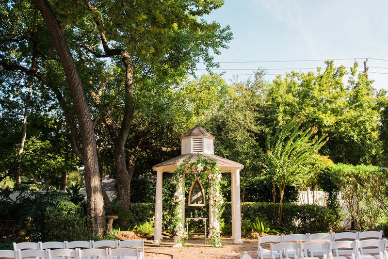 Butler's Courtyard Outdoor Ceremony gazebo decorated with flowers