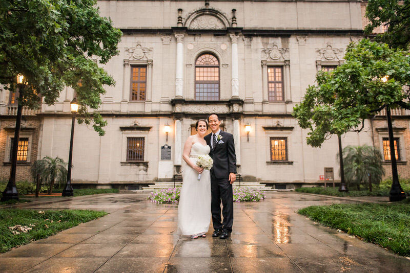 Bride and Groom in front of Julia Ideson Library
