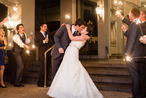Bride and Groom Kissing at Wedding Exit with Sparklers at Pine Forest Country Club