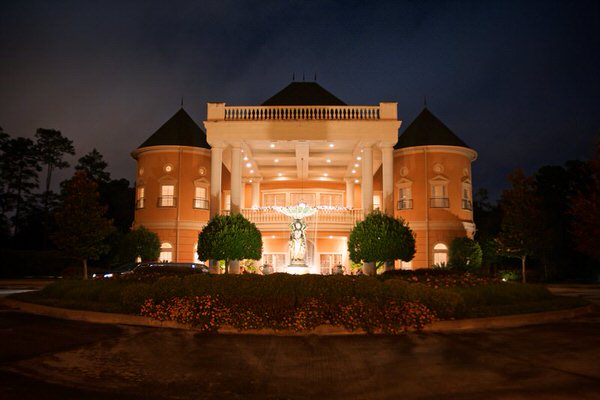 Springs Chateau Wedding Venue in Houston lit up at Night