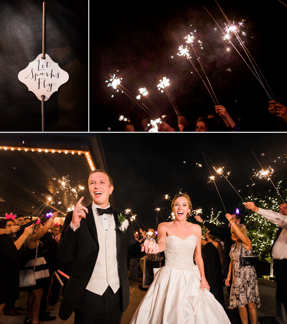 Sparklers in the air and bride and groom running through them